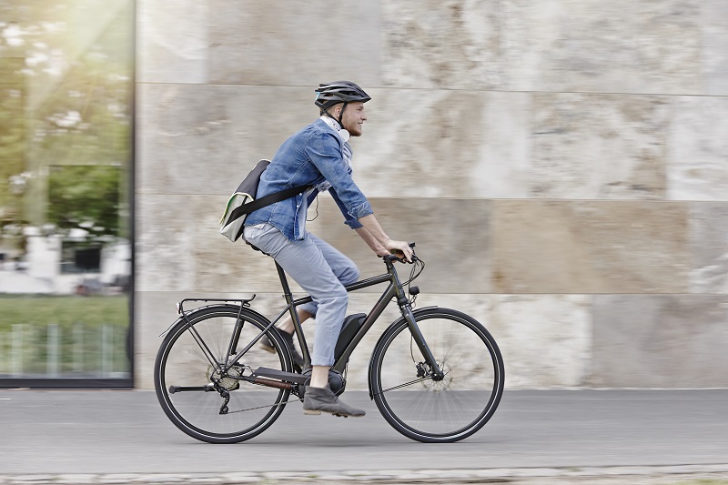 Student on his e-bike at Goethe University in Frankfurt, Germany